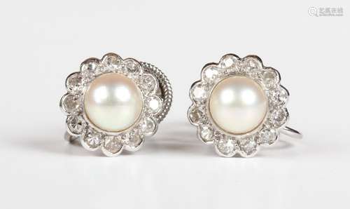 A pair of white gold, diamond and cultured pearl cluster ear...