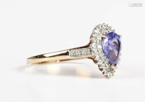 A 9ct gold ring, claw set with a pear shaped tanzanite withi...