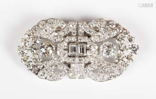 A diamond double clip brooch, circa 1920, pierced in a geome...