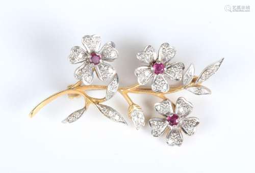A gold, ruby and diamond brooch, designed as a floral and fo...