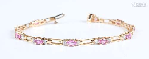 A gold, pink sapphire and diamond bracelet, claw set with te...