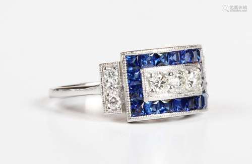 A platinum, diamond and treated sapphire panel shaped ring, ...