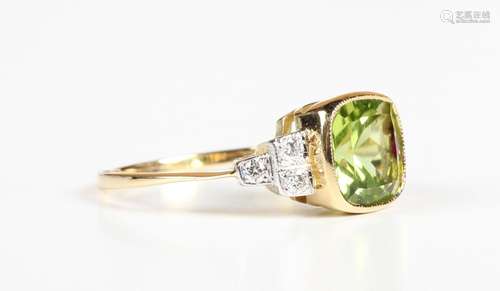 A gold, peridot and diamond ring, collet set with the cushio...