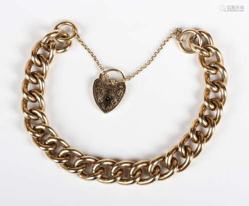 A 9ct gold solid curblink bracelet on a 9ct gold heart shape...