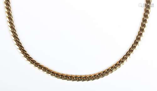 A gold necklace in a curved curblink design, on a sprung hoo...