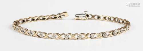 An 18ct gold and diamond bracelet in an 'X' shaped link desi...