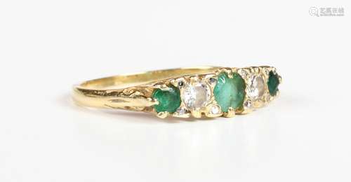 A gold, emerald and diamond ring, mounted with three circula...