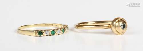 An 18ct gold, emerald and diamond seven stone half eternity ...