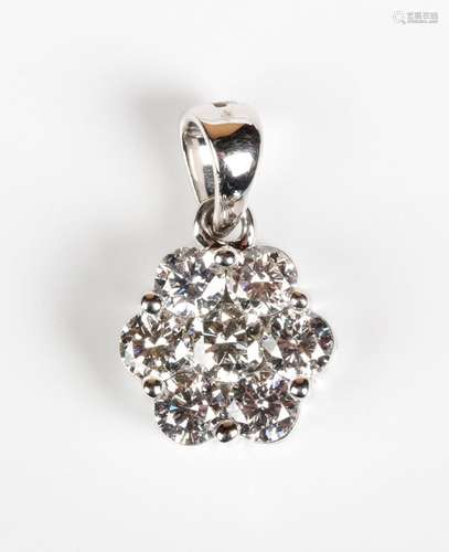 An 18ct white gold and diamond seven stone cluster pendant, ...