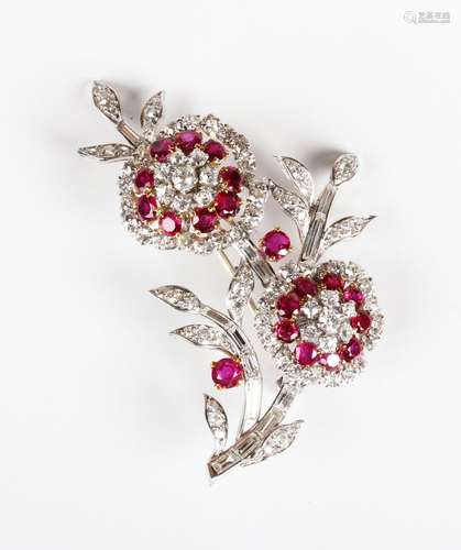 A ruby and diamond brooch, designed as a floral spray with t...