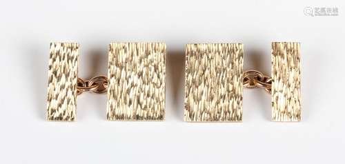 A pair of 9ct gold rectangular cufflinks with a bark texture...