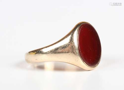 A 9ct gold and cornelian oval signet ring, Birmingham 1965, ...