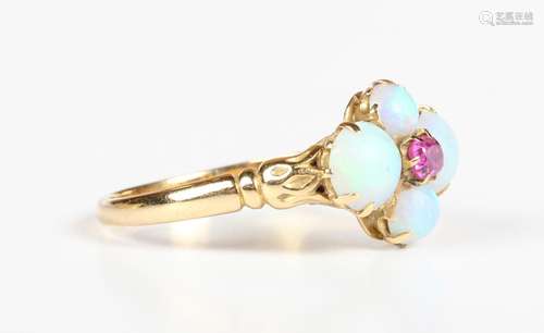 An Edwardian gold, opal and ruby ring, claw set with the cus...