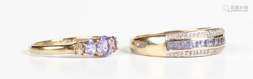 A 9ct gold ring, claw set with three oval cut tanzanites bet...