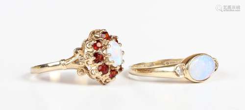 A 9ct gold, opal and diamond three stone ring, collet set wi...