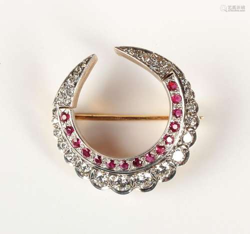 A gold, ruby and diamond crescent brooch, mounted with a row...