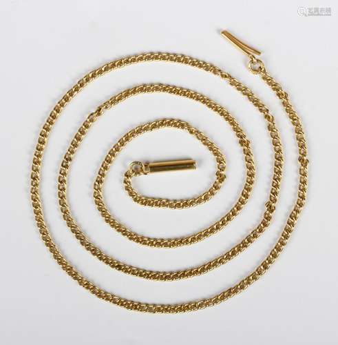 A gold curblink neckchain, detailed 'C18', on a cylindrical ...