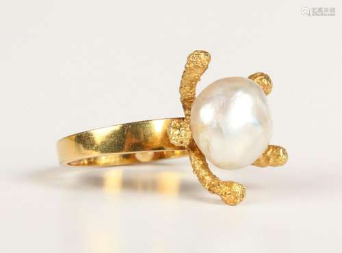 An 18ct gold ring, mounted with a cultured pearl in an abstr...