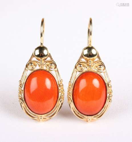 A pair of Polish gold mounted oval coral pendant earrings, e...