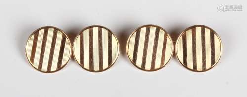 A pair of 9ct gold circular cufflinks with banded decoration...