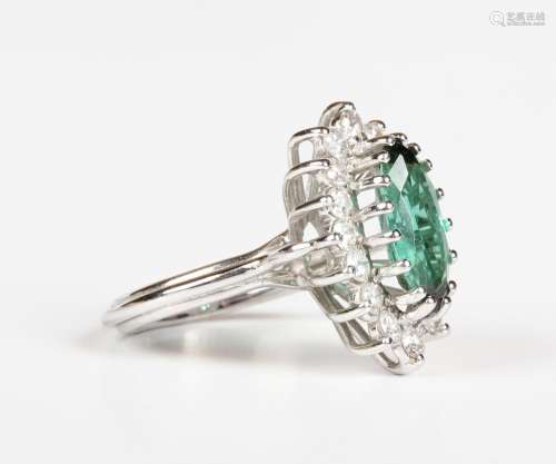 A diamond and green tourmaline marquise shaped cluster ring,...