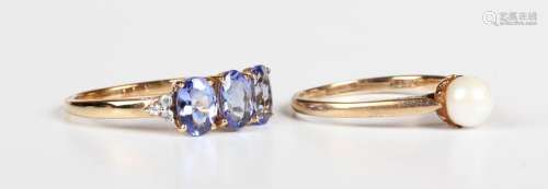A 9ct gold, tanzanite and colourless gem set ring, claw set ...
