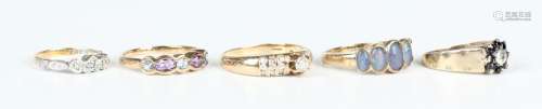 A 9ct gold and diamond ring, claw set with the principal cir...