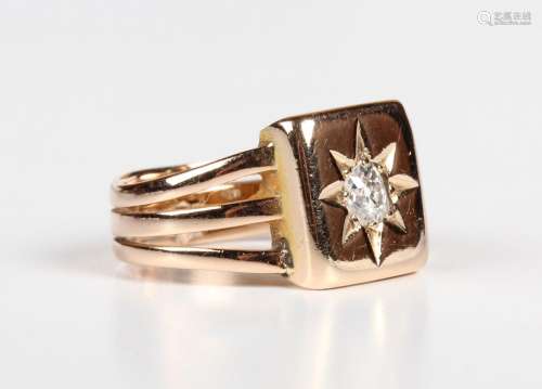 A gold ring, star set with an old mine cushion cut diamond i...