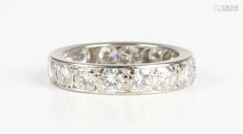 A white gold diamond full eternity ring, mounted with circul...