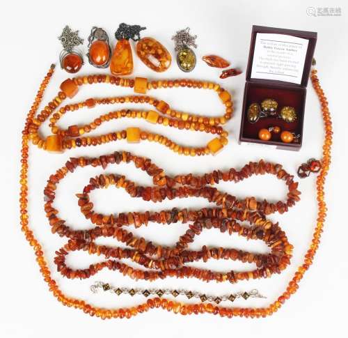 A group of mostly reconstituted and treated amber jewellery,...