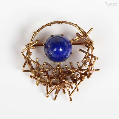 A gold and lapis lazuli brooch in an abstract design, detail...