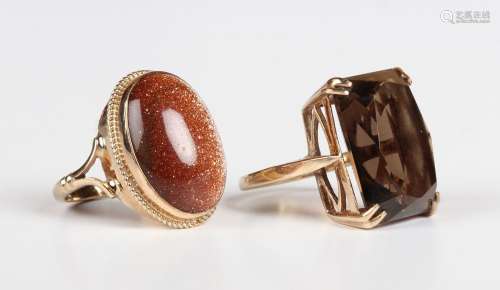 A 9ct gold ring, mounted with a rectangular cut smoky quartz...