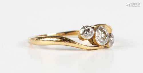 A gold and diamond three stone ring, mounted with a row of c...