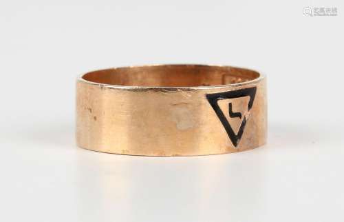 A gold and black enamelled band ring with a triangular Mason...