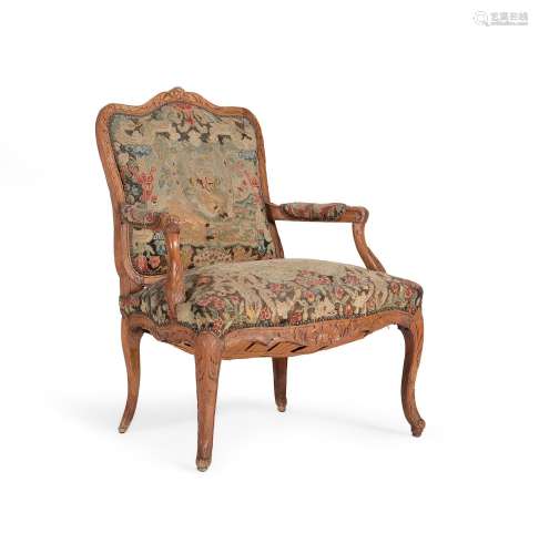 A LOUIS XV CARVED BEECH AND NEEDLEWORK UPHOLSTERED FAUTEUIL,...