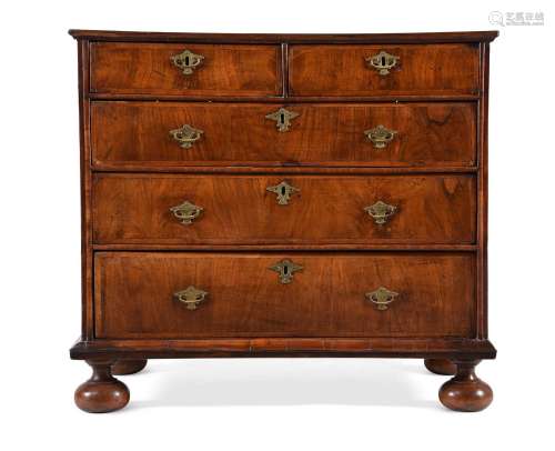 A WALNUT AND FEATHER BANDED CHEST OF DRAWERS, CIRCA 1710 AND...