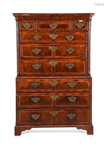 A GEORGE II FIGURED WALNUT AND FEATHER BANDED CHEST ON CHEST...