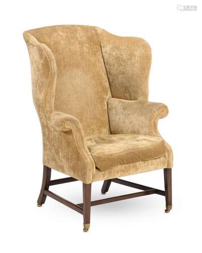 A GEORGE III MAHOGANY AND UPHOLSTERED WING ARMCHAIR, CIRCA 1...