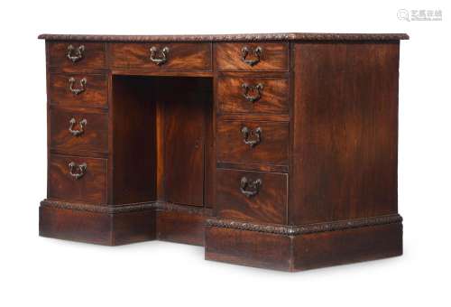 A GEORGE III MAHOGANY DESK, IN THE MANNER OF THOMAS CHIPPEND...