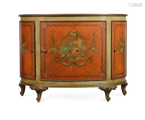 Y A SATINWOOD AND POLYCHROME PAINTED DEMI-LUNE COMMODE, IN G...