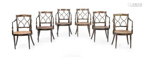 A SET OF SIX EBONISED AND PARCEL GILT ELBOW CHAIRS, EARLY 19...