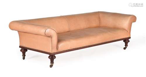 A VICTORIAN WALNUT AND LEATHER UPHOLSTERED SOFA, IN THE MANN...