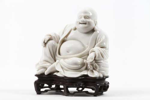 A Dehua figure of Budai