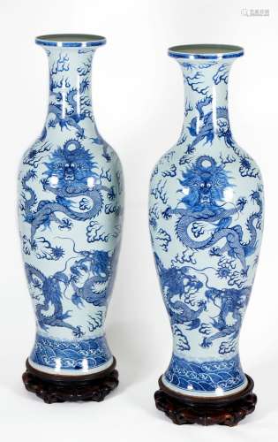 A massive pair of blue and white 'dragon' baluster vases