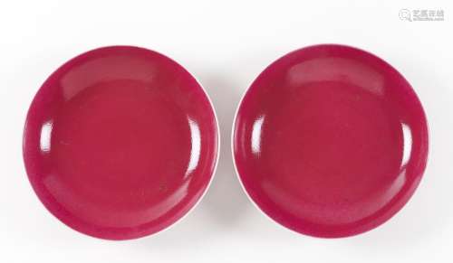 A pair of 'ruby-pink' monochrome enamelled dishes
