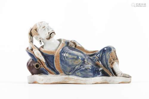 A blue and whit glazed biscuit figure of an Immortal