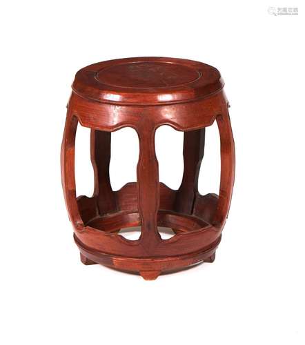 A hardwood barrel-shaped stool