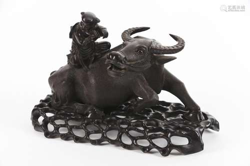 A Chinese wood carving of ‘boy on a water buffalo’