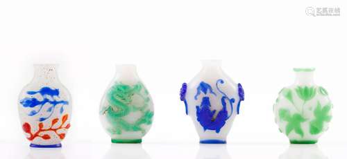 A set of four overlay glass snuff bottles