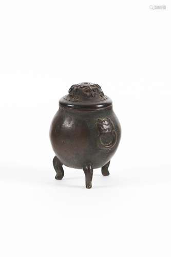 A miniature bronze cauldron